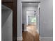 Hallway showing hardwood floors leading to a living space and kitchen at 1604 Niskey Lake Rd, Atlanta, GA 30331