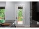 Kitchen features stainless appliances, island seating, and backyard access at 1604 Niskey Lake Rd, Atlanta, GA 30331