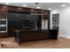 Modern kitchen featuring black marble countertops, a large center island, black cabinetry, and stainless steel ovens at 1604 Niskey Lake Rd, Atlanta, GA 30331