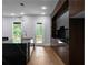 Modern kitchen with black countertops, sleek cabinets, and stainless appliances at 1604 Niskey Lake Rd, Atlanta, GA 30331