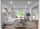Bright living room with large windows and a plush white sofa offers a stylish and inviting atmosphere at 1604 Niskey Lake Rd, Atlanta, GA 30331