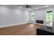 Bright living room boasts hardwood floors, fireplace and large windows at 1604 Niskey Lake Rd, Atlanta, GA 30331