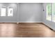 Spacious, light-filled living room with hardwood floors and white trim at 1604 Niskey Lake Rd, Atlanta, GA 30331