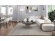 Bright living room with modern decor, a large sectional sofa, and stylish furnishings provides a comfortable gathering space at 1604 Niskey Lake Rd, Atlanta, GA 30331