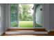 Bright room featuring sliding doors to an outdoor patio with artificial grass at 1604 Niskey Lake Rd, Atlanta, GA 30331