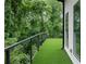 Artificial turf on a rooftop patio with black railings and great views of the surrounding trees at 1604 Niskey Lake Rd, Atlanta, GA 30331