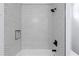 Updated shower with black trim and fixtures, as well as unique hexagon tiling at 1604 Niskey Lake Rd, Atlanta, GA 30331