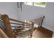 Modern staircase featuring wood railing, black metal balusters, and hardwood stairs at 1604 Niskey Lake Rd, Atlanta, GA 30331