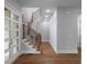 Open staircase design with wood treads and black railings, with foyer entrance at 1604 Niskey Lake Rd, Atlanta, GA 30331