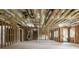 Large unfinished room features exposed ceiling, insulation, framing, and a door at 1604 Niskey Lake Rd, Atlanta, GA 30331