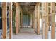 Hallway in an unfinished room showcasing wood framing and insulation at 1604 Niskey Lake Rd, Atlanta, GA 30331