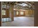 Spacious unfinished room showcasing framing, insulation and natural light streaming through the windows at 1604 Niskey Lake Rd, Atlanta, GA 30331