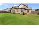 Large grassy backyard and brick home with ample space for outdoor activities and landscaping at 3317 Sweetleaf Ln, Buford, GA 30519