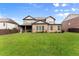 Spacious backyard with lush green lawn and well-maintained landscaping, perfect for outdoor activities at 3317 Sweetleaf Ln, Buford, GA 30519