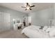 Bedroom with a ceiling fan, neutral paint and carpet, and a desk for doing homework at 3317 Sweetleaf Ln, Buford, GA 30519