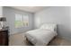 Bright bedroom with plush carpeting, a large window and a neatly made bed at 3317 Sweetleaf Ln, Buford, GA 30519