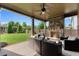 Inviting covered patio with stone fireplace and comfortable seating, perfect for outdoor relaxation at 3317 Sweetleaf Ln, Buford, GA 30519
