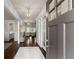 Inviting entryway features dark hardwood floors, a light-colored rug and view of the living room at 3317 Sweetleaf Ln, Buford, GA 30519