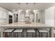 Kitchen featuring a large center island with seating, pendant lighting, and stainless steel appliances at 3317 Sweetleaf Ln, Buford, GA 30519