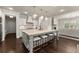 Open kitchen with a large island, pendant lighting, stainless steel appliances and an eat-in area at 3317 Sweetleaf Ln, Buford, GA 30519