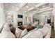 Spacious living room boasts coffered ceilings, fireplace, custom built-ins, and hardwood floors at 3317 Sweetleaf Ln, Buford, GA 30519