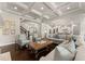 Open-concept living room with coffered ceiling, fireplace, and hardwood floors offers ample space at 3317 Sweetleaf Ln, Buford, GA 30519
