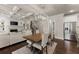 Open concept featuring living room with a fireplace, kitchen with stainless appliances, and dining area at 3317 Sweetleaf Ln, Buford, GA 30519