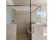 Spacious walk-in shower with tiled walls and flooring, and a glass enclosure at 3317 Sweetleaf Ln, Buford, GA 30519