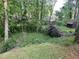 Lush backyard featuring a storage shed and surrounded by mature trees for added privacy at 743 San Fernando Se Dr, Smyrna, GA 30080