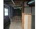Unfinished basement features exposed beams, concrete flooring, and a window at 743 San Fernando Se Dr, Smyrna, GA 30080