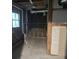 Unfinished basement space with exposed beams, concrete flooring, and a small window at 743 San Fernando Se Dr, Smyrna, GA 30080