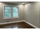 A light-filled bedroom with freshly painted walls and beautifully refinished hardwood floors at 743 San Fernando Se Dr, Smyrna, GA 30080