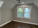 Bright bedroom with hardwood floors, fresh paint, and a large window offering natural light at 743 San Fernando Se Dr, Smyrna, GA 30080
