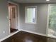 Bright bedroom with hardwood floors features a door to the outside and large window at 743 San Fernando Se Dr, Smyrna, GA 30080