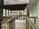 Spacious backyard deck with wood railings offers views of the yard at 743 San Fernando Se Dr, Smyrna, GA 30080