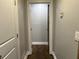 Hallway with hardwood floors and neutral colored walls at 743 San Fernando Se Dr, Smyrna, GA 30080