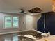 Spacious living room with large windows, stylish accent wall, and hardwood floors at 743 San Fernando Se Dr, Smyrna, GA 30080