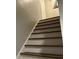 Staircase with wooden treads, featuring white painted risers, and a freshly painted wall at 743 San Fernando Se Dr, Smyrna, GA 30080