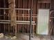 An unfinished basement with exposed shelving and access door at 1978 Winding Creek Sw Ln, Marietta, GA 30064