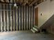 An unfinished basement with concrete walls and wooden door at 1978 Winding Creek Sw Ln, Marietta, GA 30064