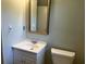 Bathroom includes a vanity, mirror, and toilet at 1978 Winding Creek Sw Ln, Marietta, GA 30064