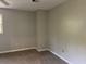 This bedroom features a carpeted floor and neutral colored walls at 1978 Winding Creek Sw Ln, Marietta, GA 30064