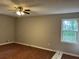 Cozy bedroom with natural light from the window and ceiling fan at 1978 Winding Creek Sw Ln, Marietta, GA 30064