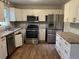 Well-equipped kitchen featuring modern stainless steel appliances and ample counter space at 1978 Winding Creek Sw Ln, Marietta, GA 30064