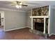 Inviting living room with decorative stone fireplace, ceiling fan and a view to the kitchen at 1978 Winding Creek Sw Ln, Marietta, GA 30064