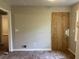 Spacious room showing signs of needed repair with doorway and air vent at 1978 Winding Creek Sw Ln, Marietta, GA 30064