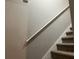 Carpeted staircase with handrail at 1978 Winding Creek Sw Ln, Marietta, GA 30064