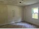 Bedroom offers a bright window and hardwood floors. It is ready for customization and personal design at 3831 Dillard St, Powder Springs, GA 30127