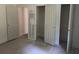 A view of the bedroom that showcases multiple doorways that provide access to the closet and other rooms at 3831 Dillard St, Powder Springs, GA 30127