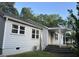 Charming exterior view of home featuring gray siding, a covered front porch, and well-maintained landscaping at 3831 Dillard St, Powder Springs, GA 30127